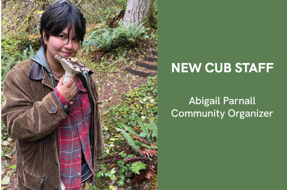 Image: Abigail smiles with a foraged mushroom; Text: New CUB Staff, Abigail Parnall, Community Organizer