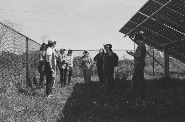 Community members gather around Tatiana Siegenthaler-Rodriguez, Verde’s Builds Program Manager, as she shares how the solar park was funded through the Portland Clean Energy Fund.