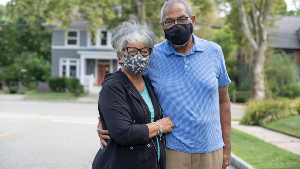 Couple wearing mask in neighborhood