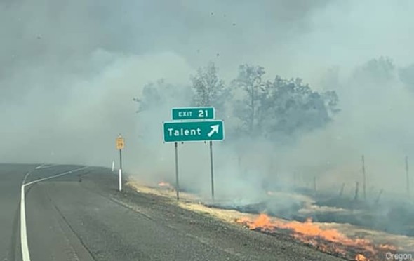 Exit sign for Talent, Oregon surrounded by smoke during the 2020 Almeda Wild Fire