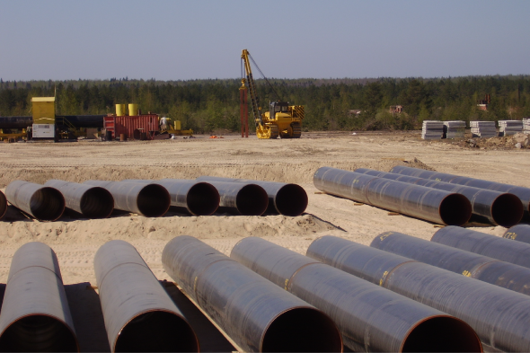 Construction site with pipes on the group