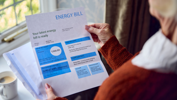 Woman holding energy bill