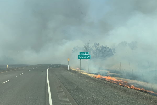 Exit sign for Talent, Oregon surrounded by smoke during the 2020 Almeda Wild Fire